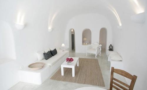 Griekse witte slaapkamer in Santorini Griekse witte slaapkamer in Santorini