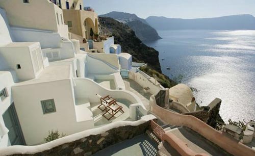 Griekse witte slaapkamer in Santorini Griekse witte slaapkamer in Santorini