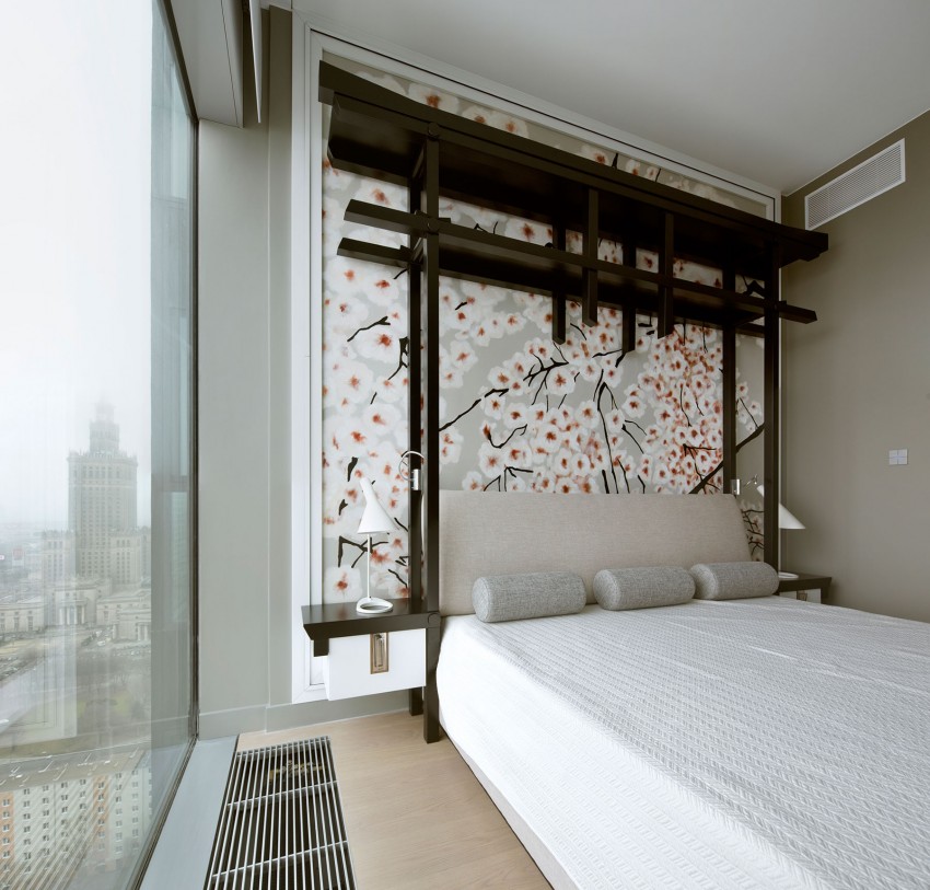 Aziatische slaapkamer met bloesem behang