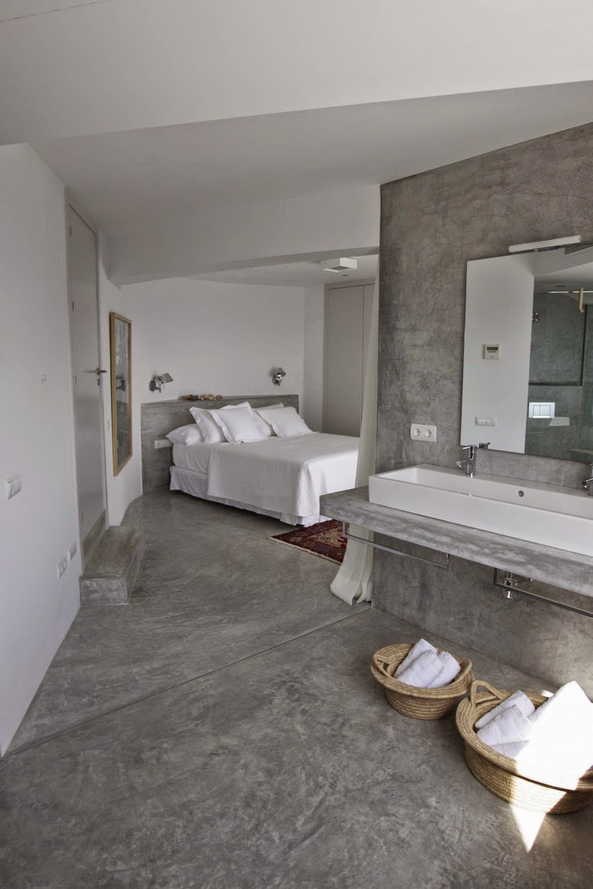Betonstuc slaapkamer met open badkamer