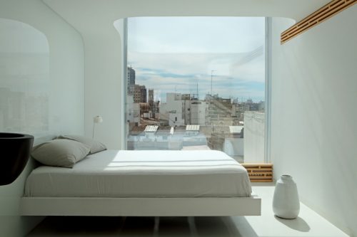 Minimalistische slaapkamer met ensuite badkamer Minimalistische slaapkamer met ensuite badkamer