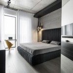 Moderne slaapkamer met een betonnen plafond