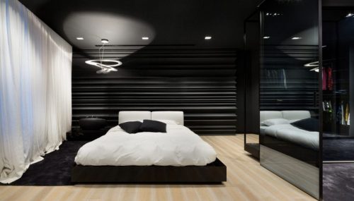 Moderne zwart wit slaapkamer met inloopkast