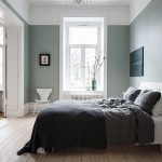 Olijfgroene muren in een Scandinavische slaapkamer