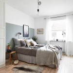Scandinavische slaapkamer met hoek kledingkast