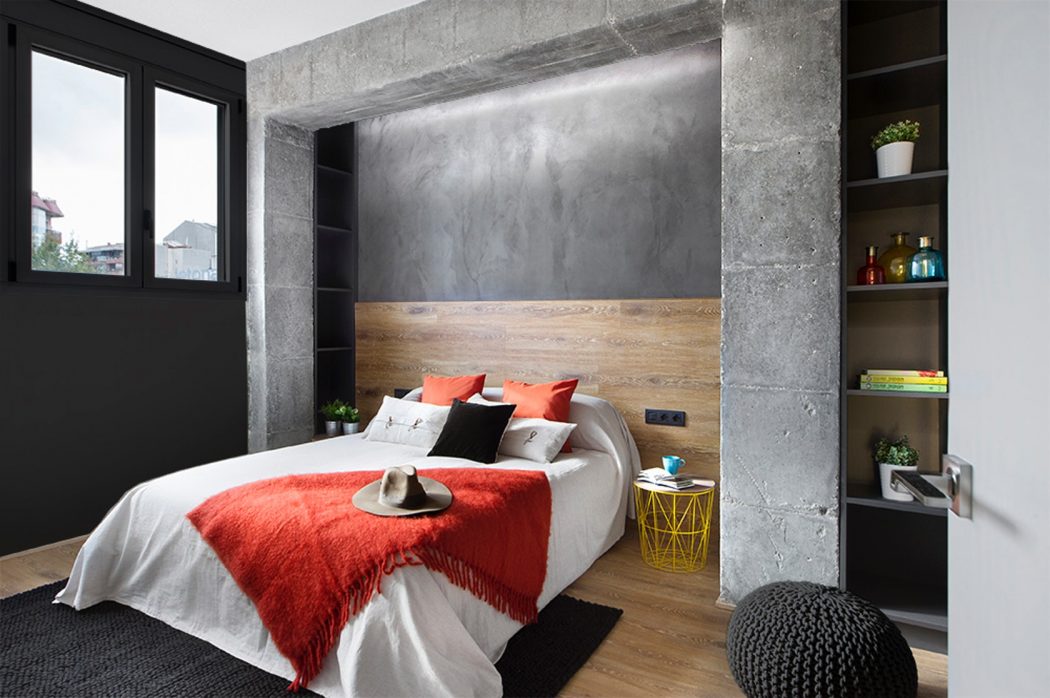 Slaapkamer met hout, beton en betonstuc