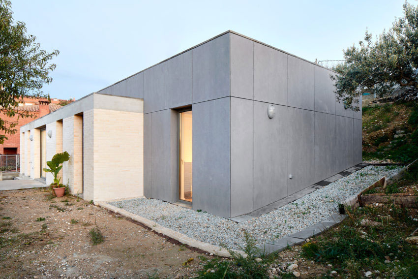 Stoere slaapkamer met gewelfd plafond van beton Stoere slaapkamer met gewelfd plafond van beton