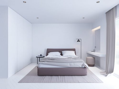 Strakke witte minimalistische slaapkamer met bruin- en zwarttinten